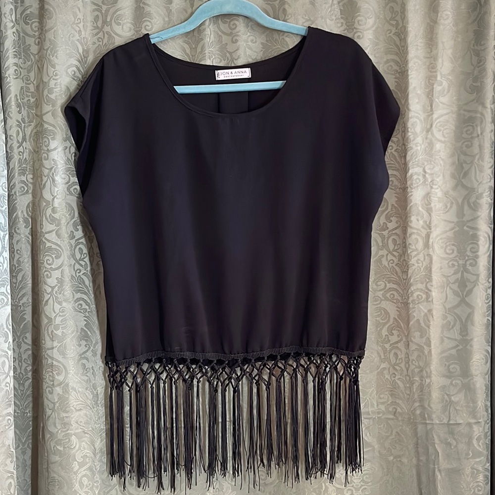 Jon & Anna contemporary black short sleeve shirt. Fun fringe bottom.